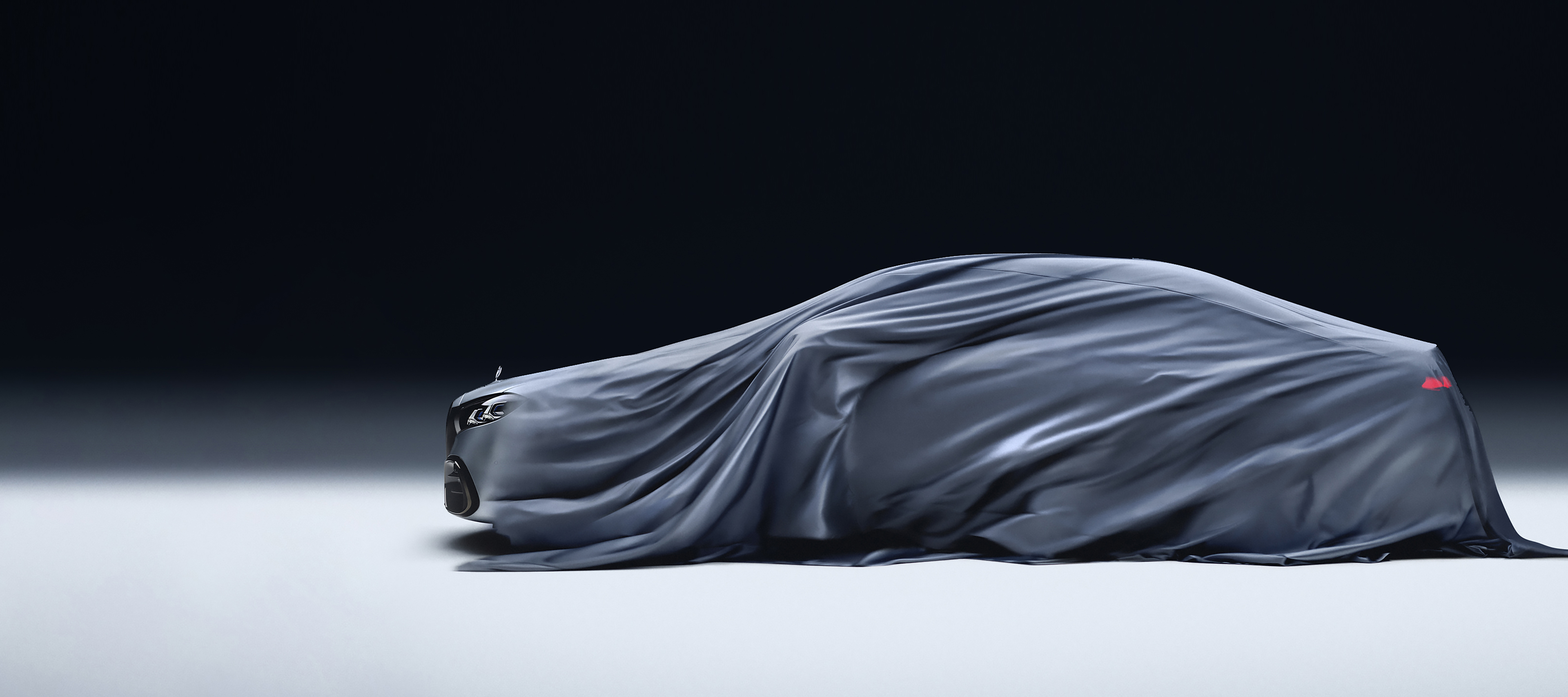 140-Hour Sales Event The image shows a car being covered with a dark, silky cloth against a plain dark background