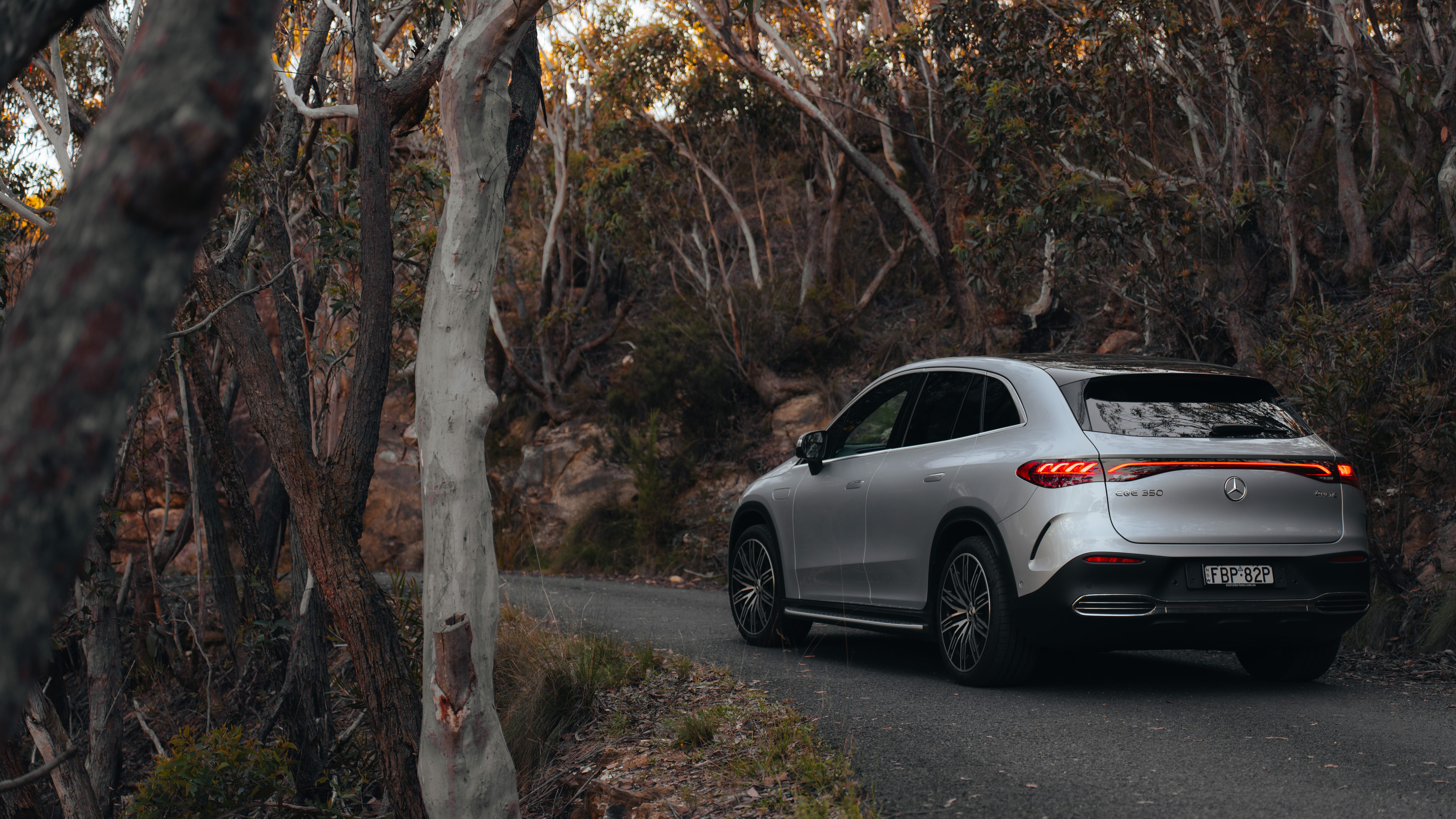 A car driving down a country road A car driving down a country road