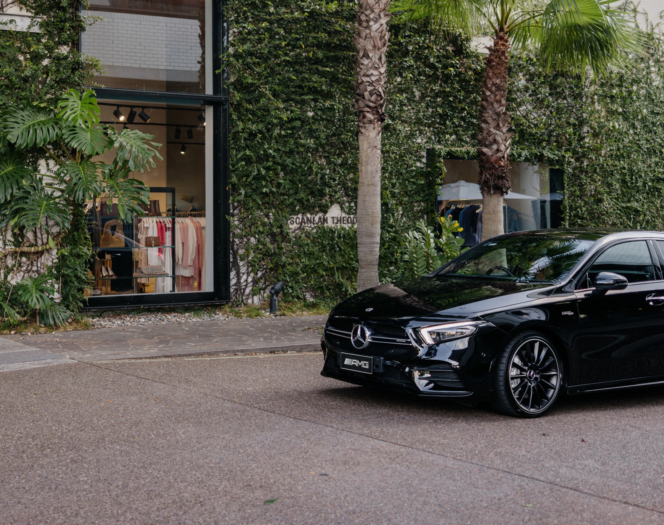 A black Mercedes-AMG A 35 4MATIC driving through a Brisbane laneway. Image credit/photographer: Paul Bamford.
