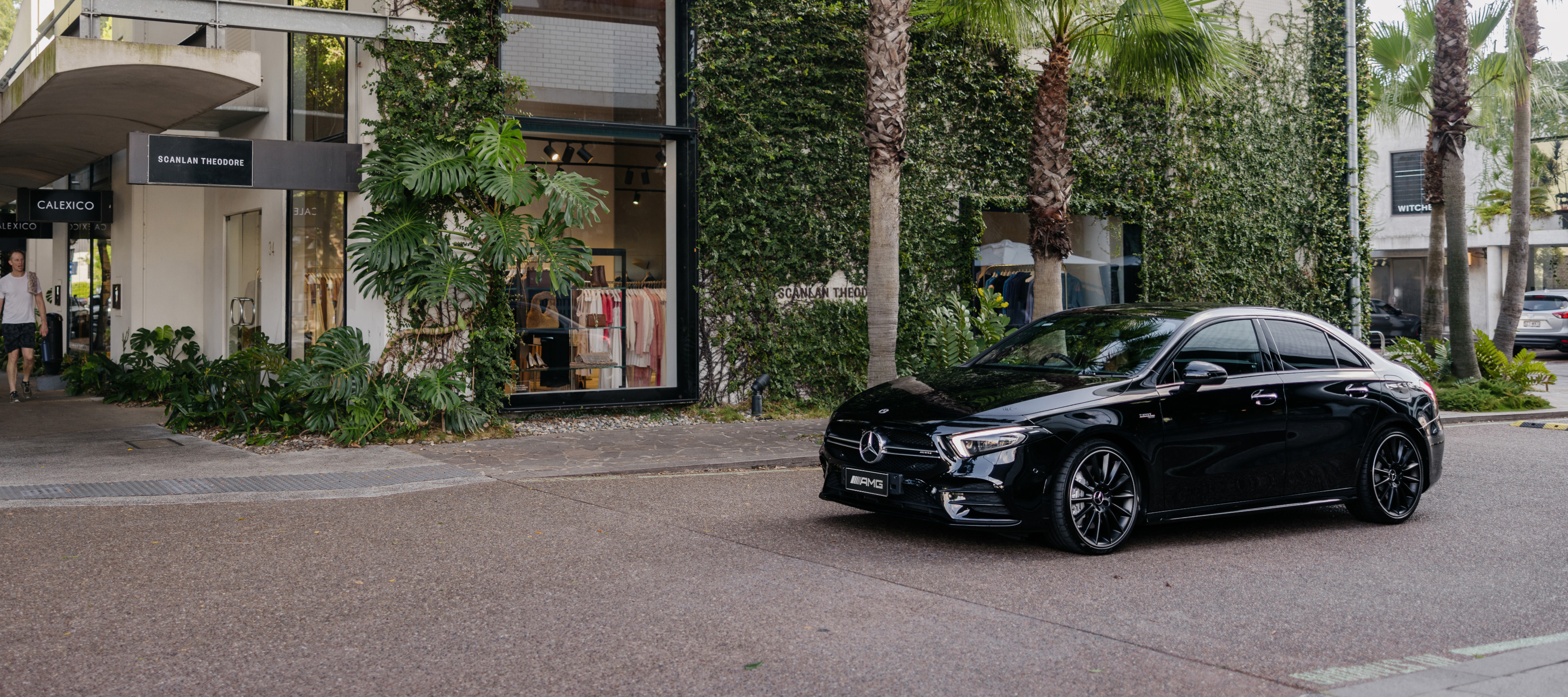 Mercedes-AMG A 35 4MATIC A black Mercedes-AMG A 35 4MATIC driving through a Brisbane laneway. Image credit/photographer: Paul Bamford.