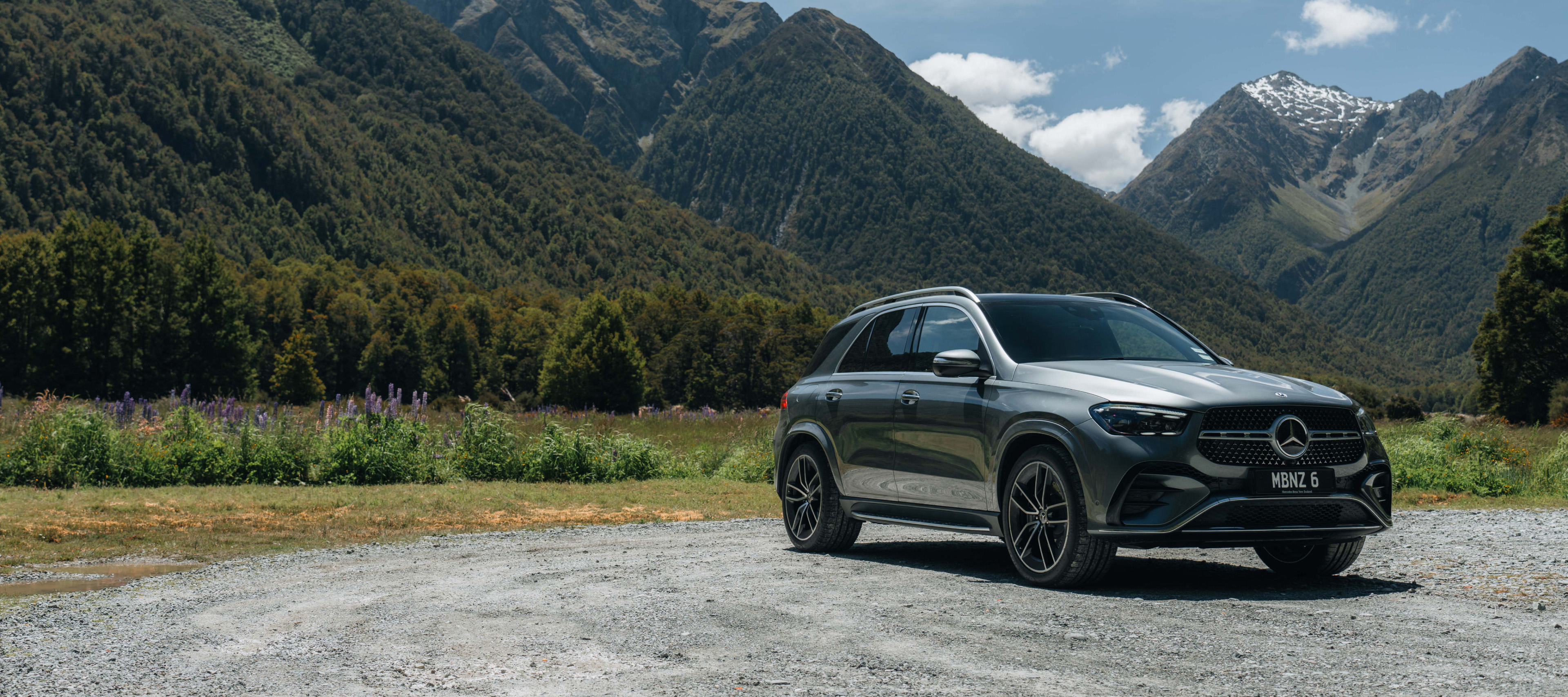 Mercedes-Benz GLE SUV A Mercedes-Benz GLE SUV parked in front of a mountain range. Image credit/photographer: Andrei Diomidov