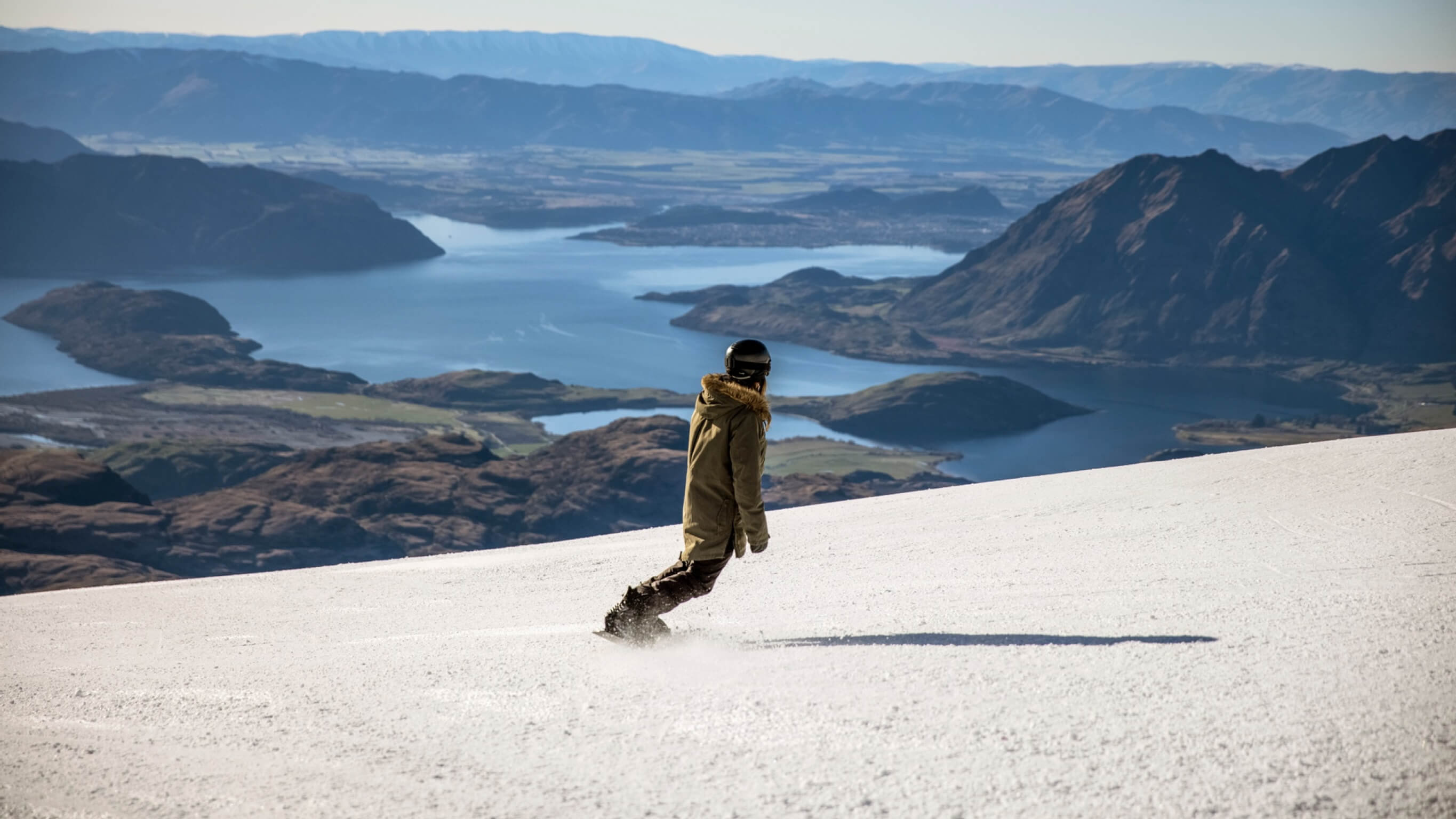 Treble Cone resort A solo snowboarder at Treble Cone resort with mountain views