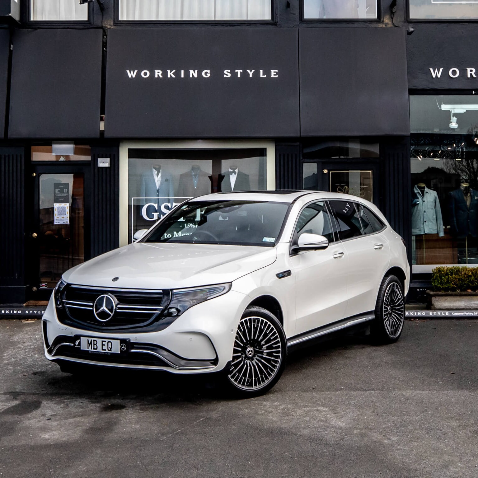 A car in front of a shop