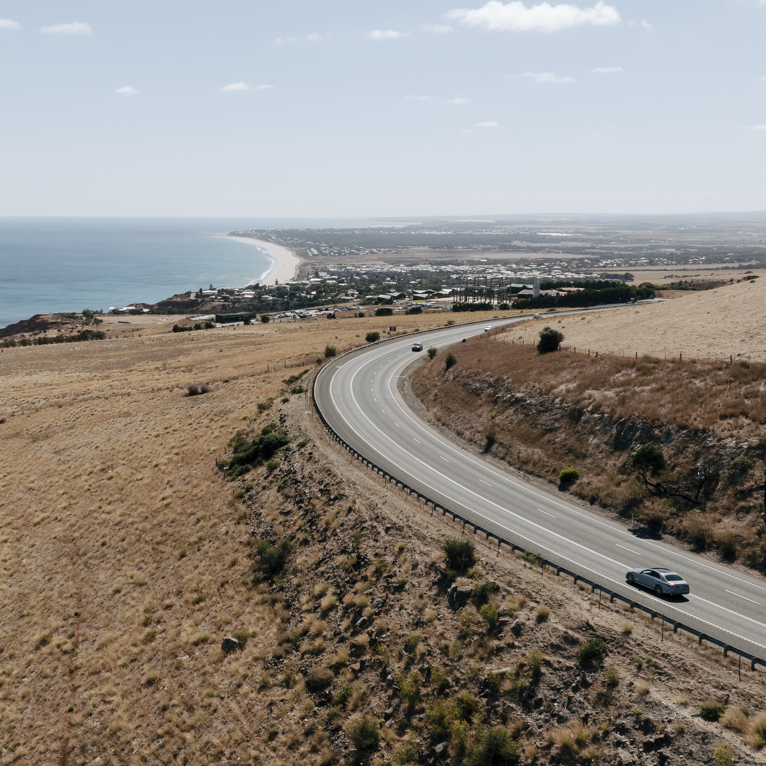 A Mercedes-Benz C-Class Sedan driving on a road in the Fleurieu Peninsula, SA.