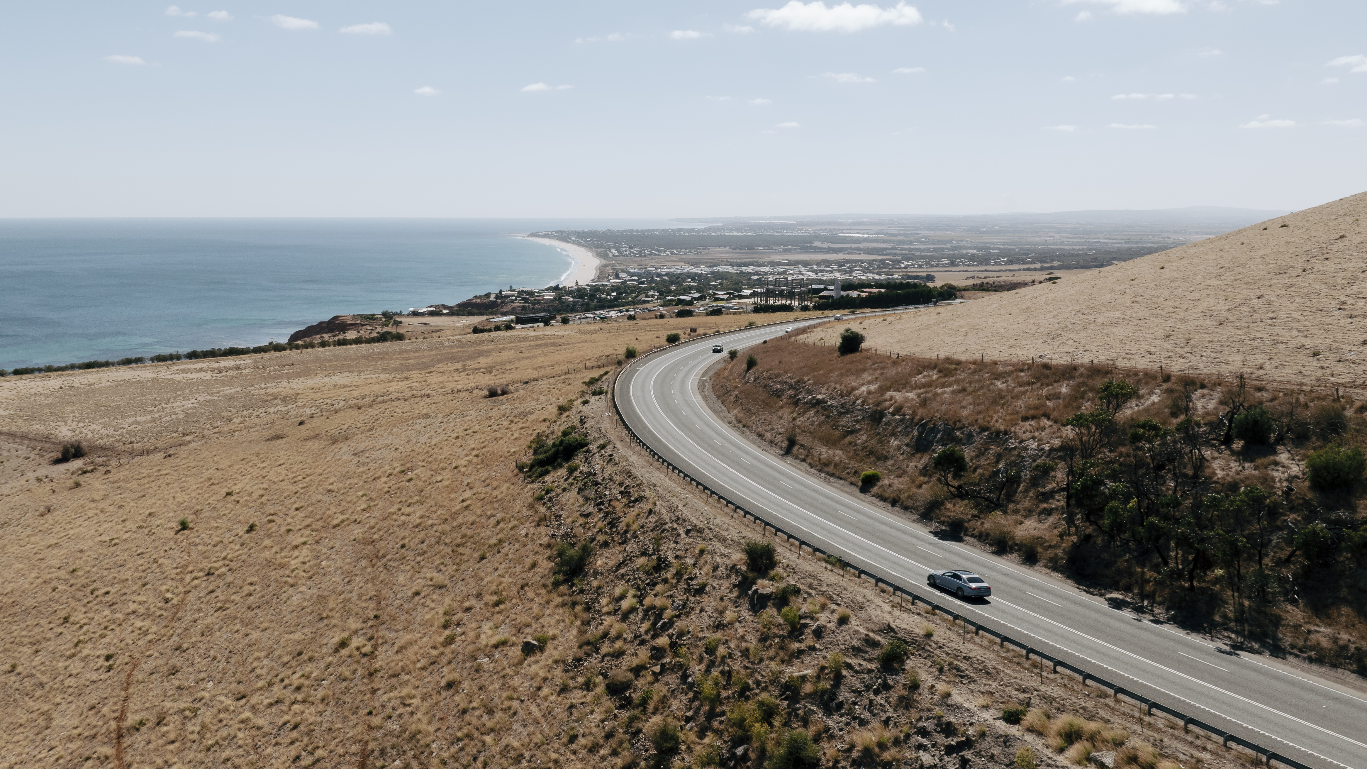 A Mercedes-Benz C-Class Sedan driving on a road in the Fleurieu Peninsula, SA. A Mercedes-Benz C-Class Sedan driving on a road in the Fleurieu Peninsula, SA.