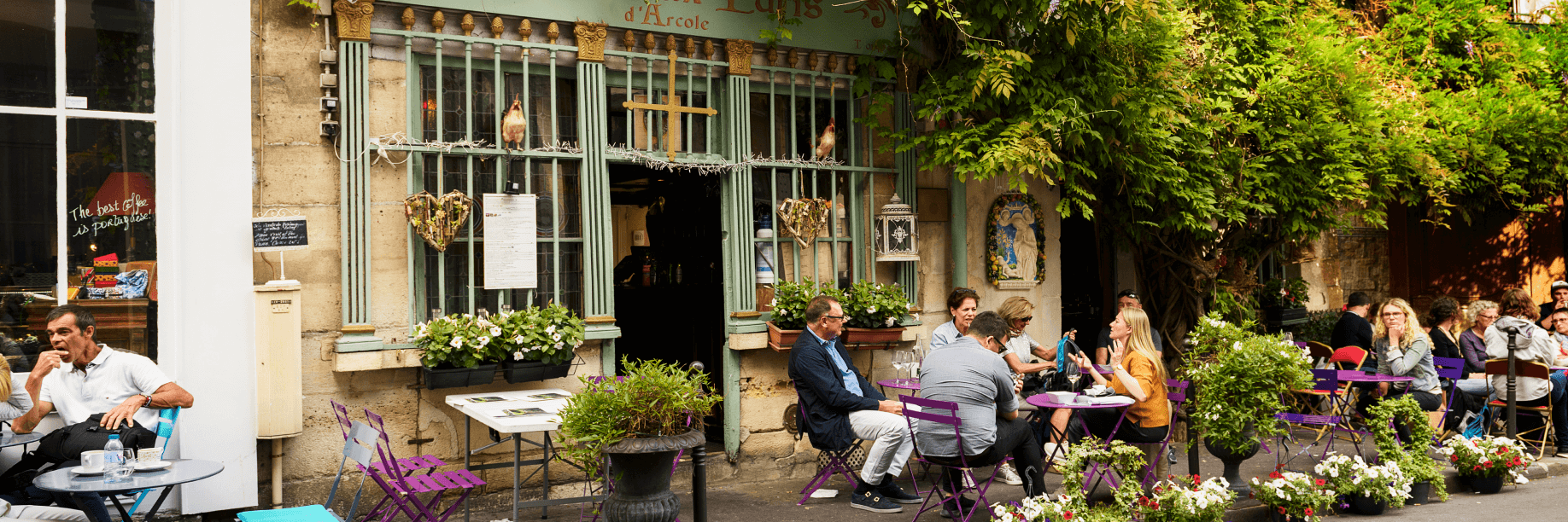 The streets of Paris People dining outside on a Paris street