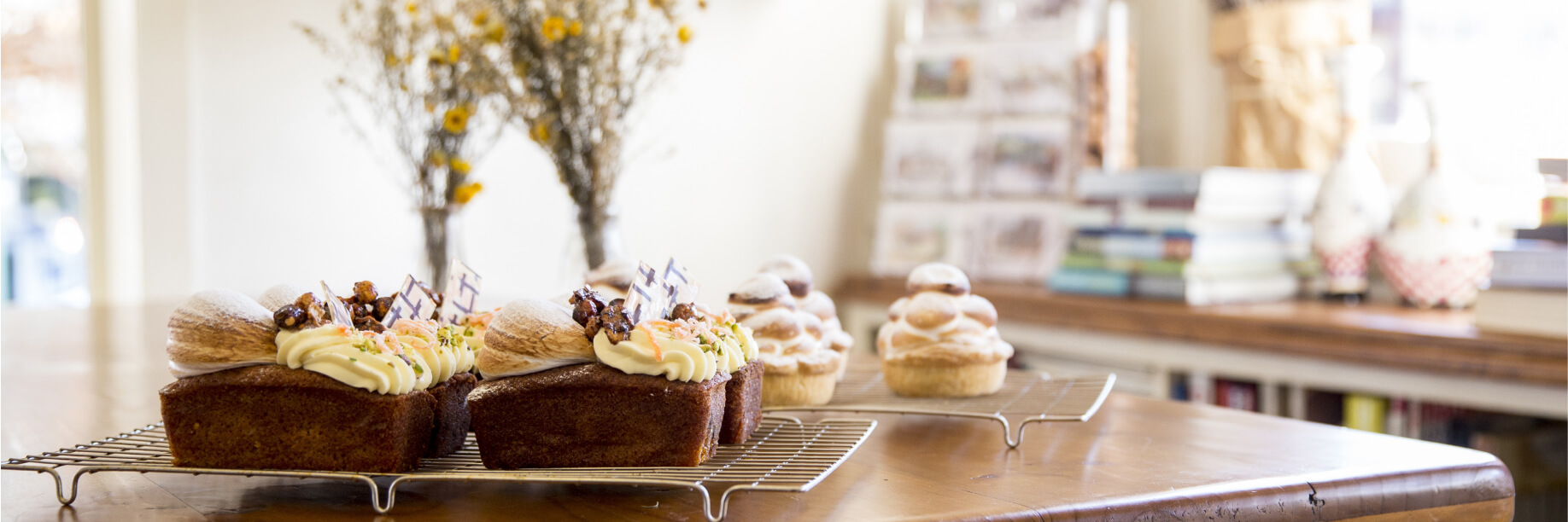 Old Mill Cafe and Bakery Cakes on a rustic table