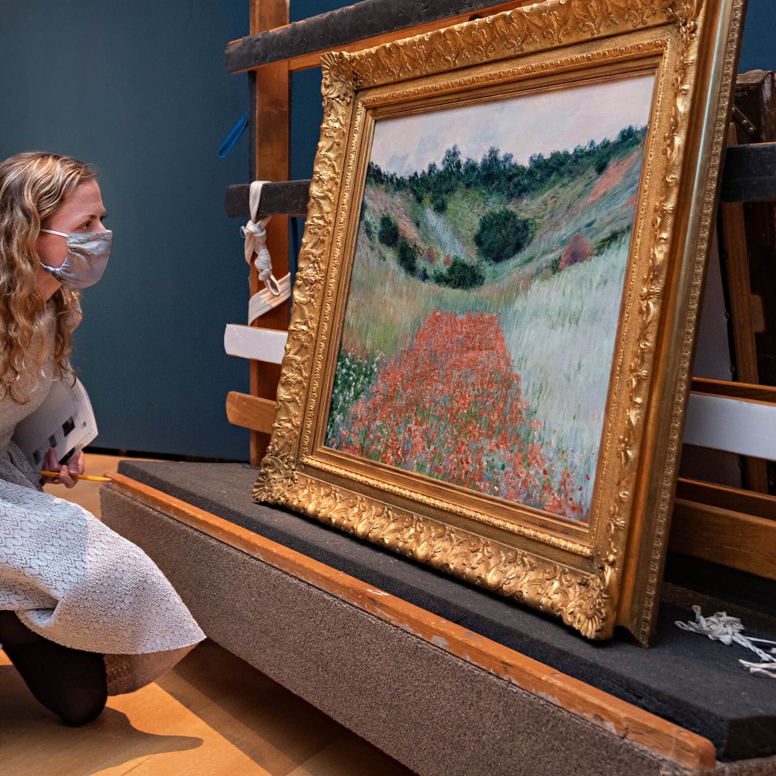 Curators inspect French Impressionist works at the Museum of Fine Arts, Boston.