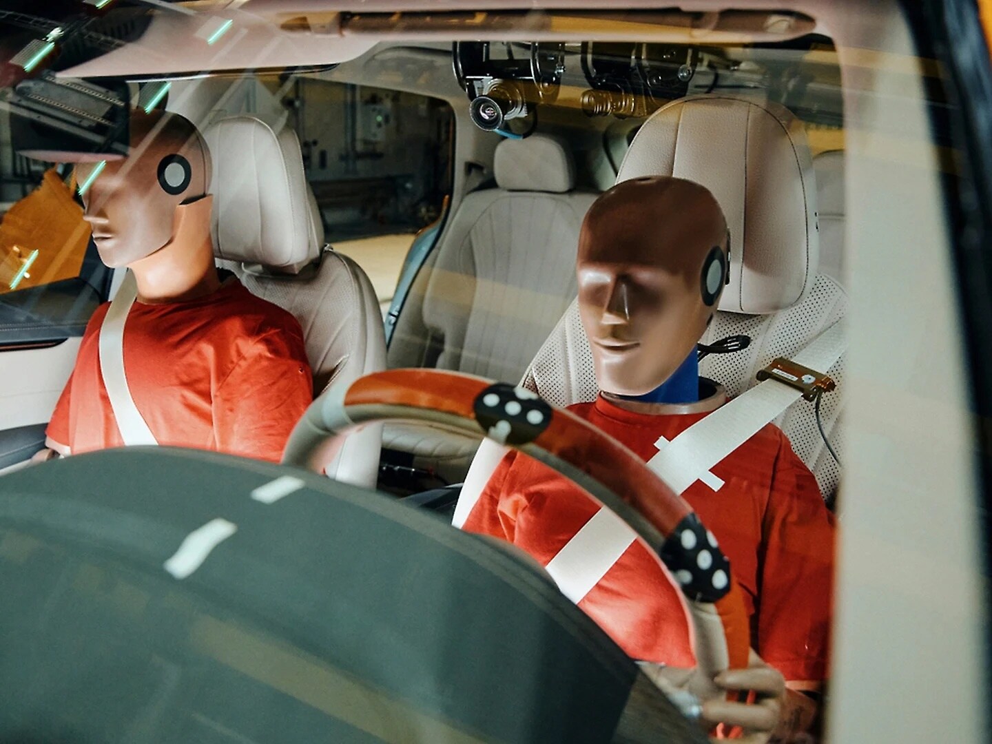 Dummies in a crash-test vehicle