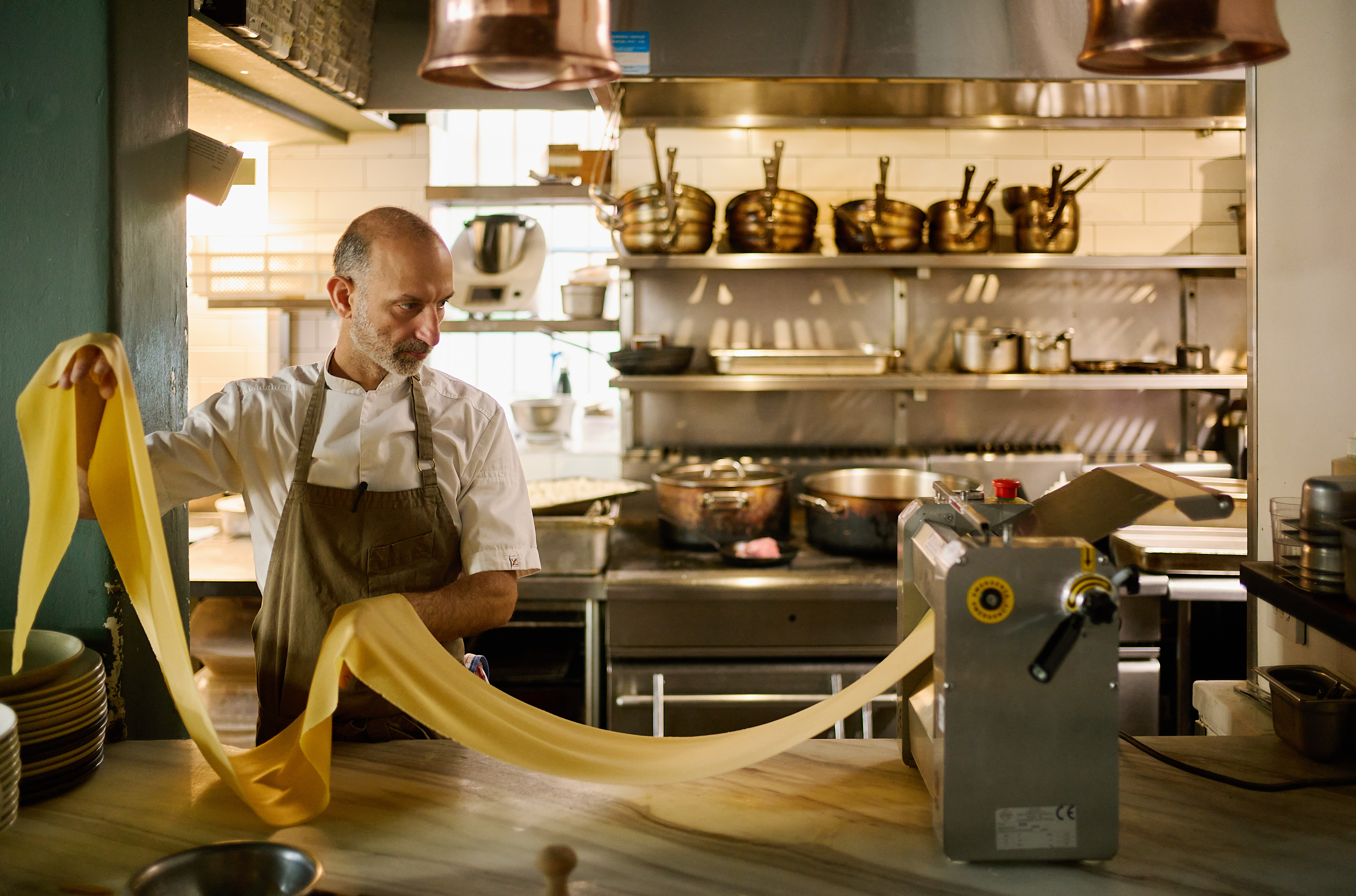 Chef Andreas Papadakis making pasta by hand Chef Andreas Papadakis making pasta by hand