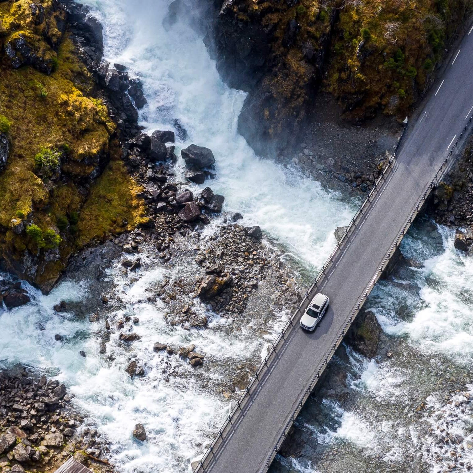 Aerial shot of Mercedes-Benz vehicle driving.