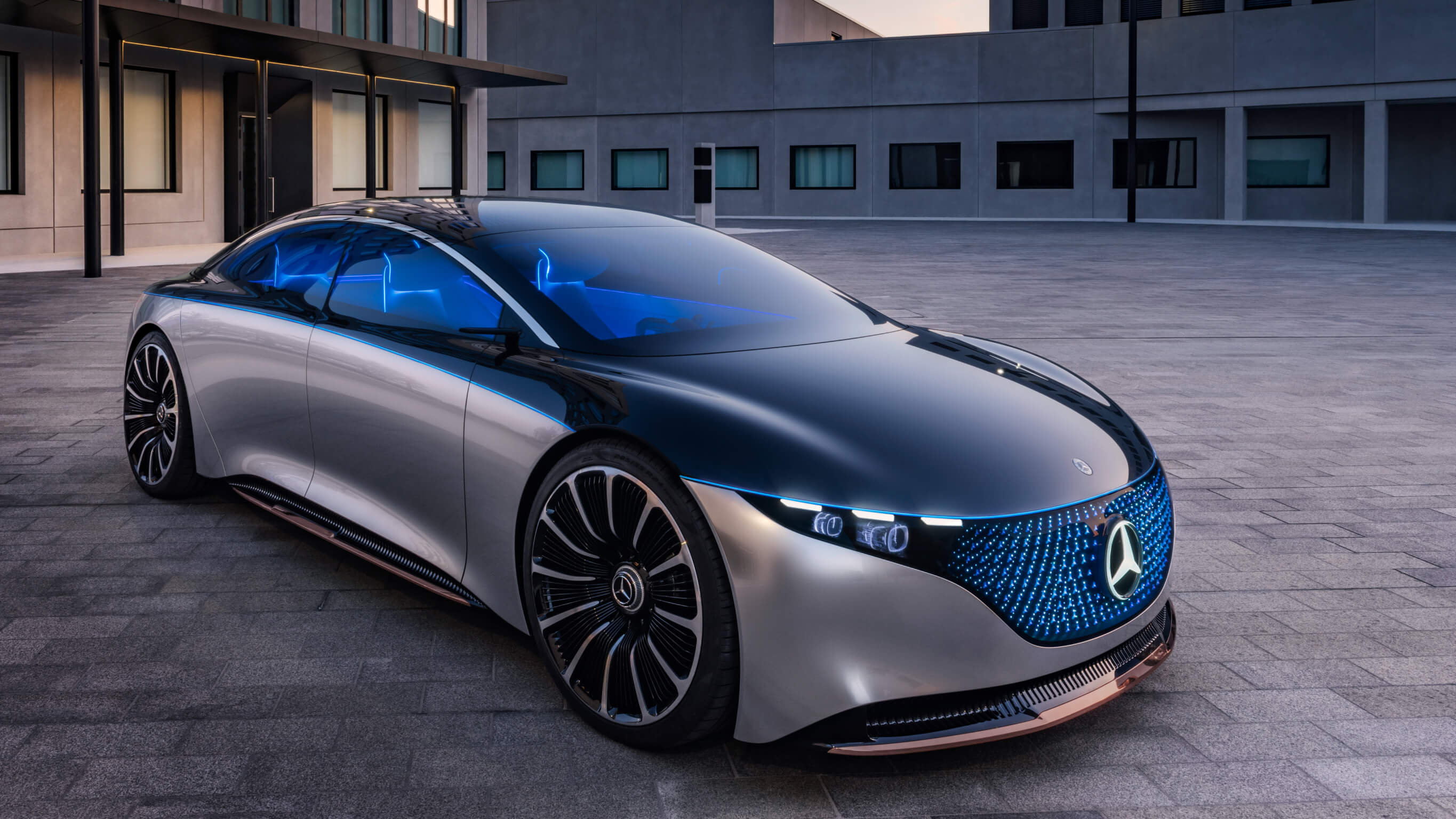 VISION EQS A luxurious blue and grey car in a courtyard