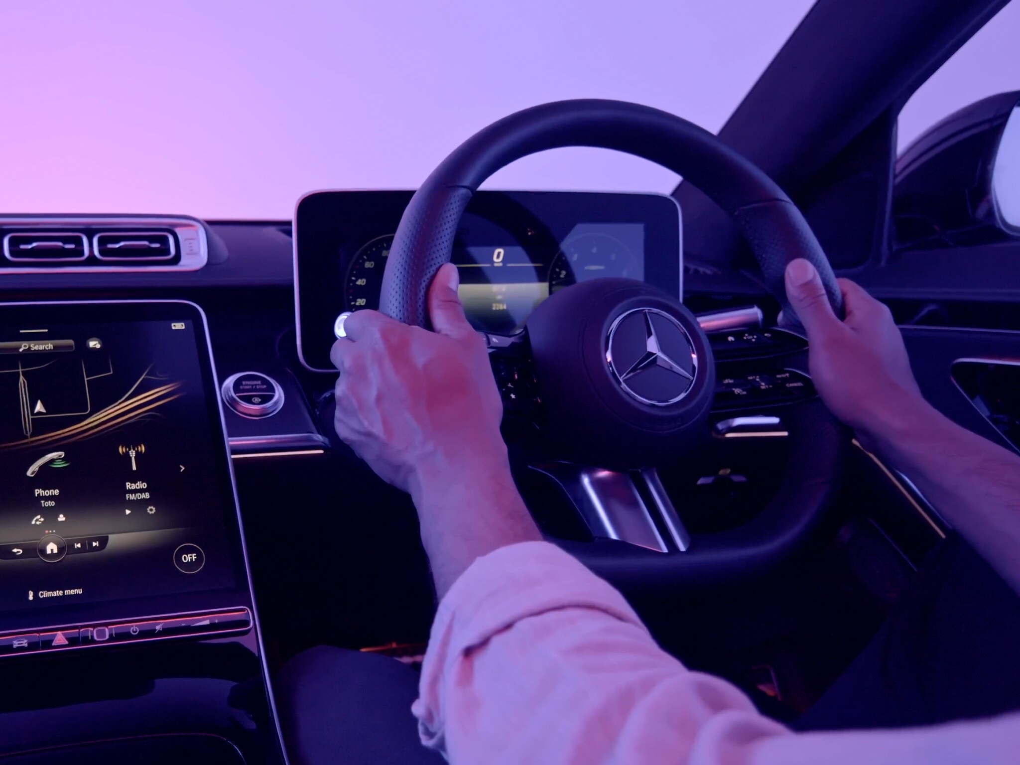 The image shows the Mercedes-Benz cockpit.