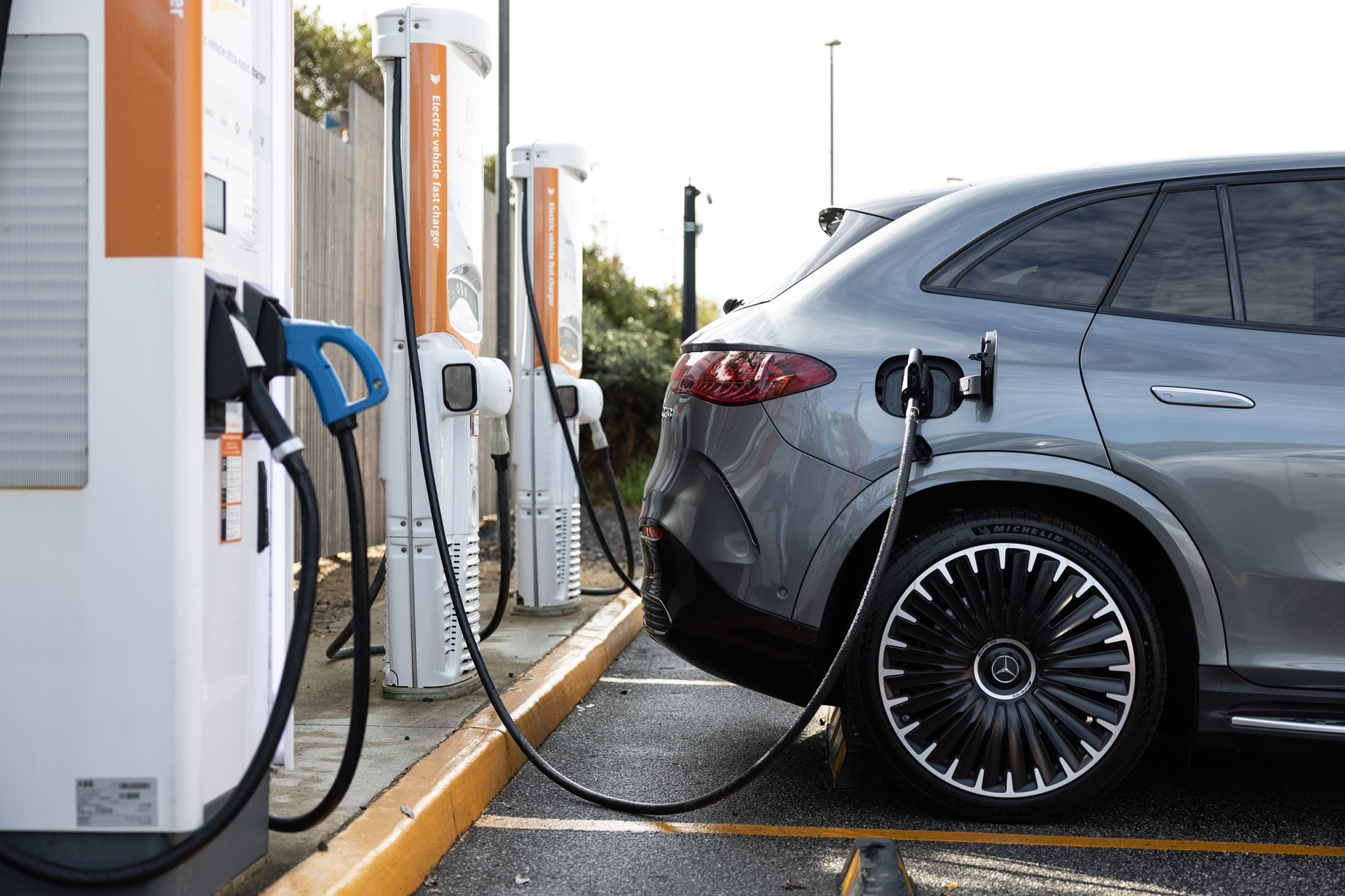 a Mercedes-Benz EQE SUV being charged a Mercedes-Benz EQE SUV being charged