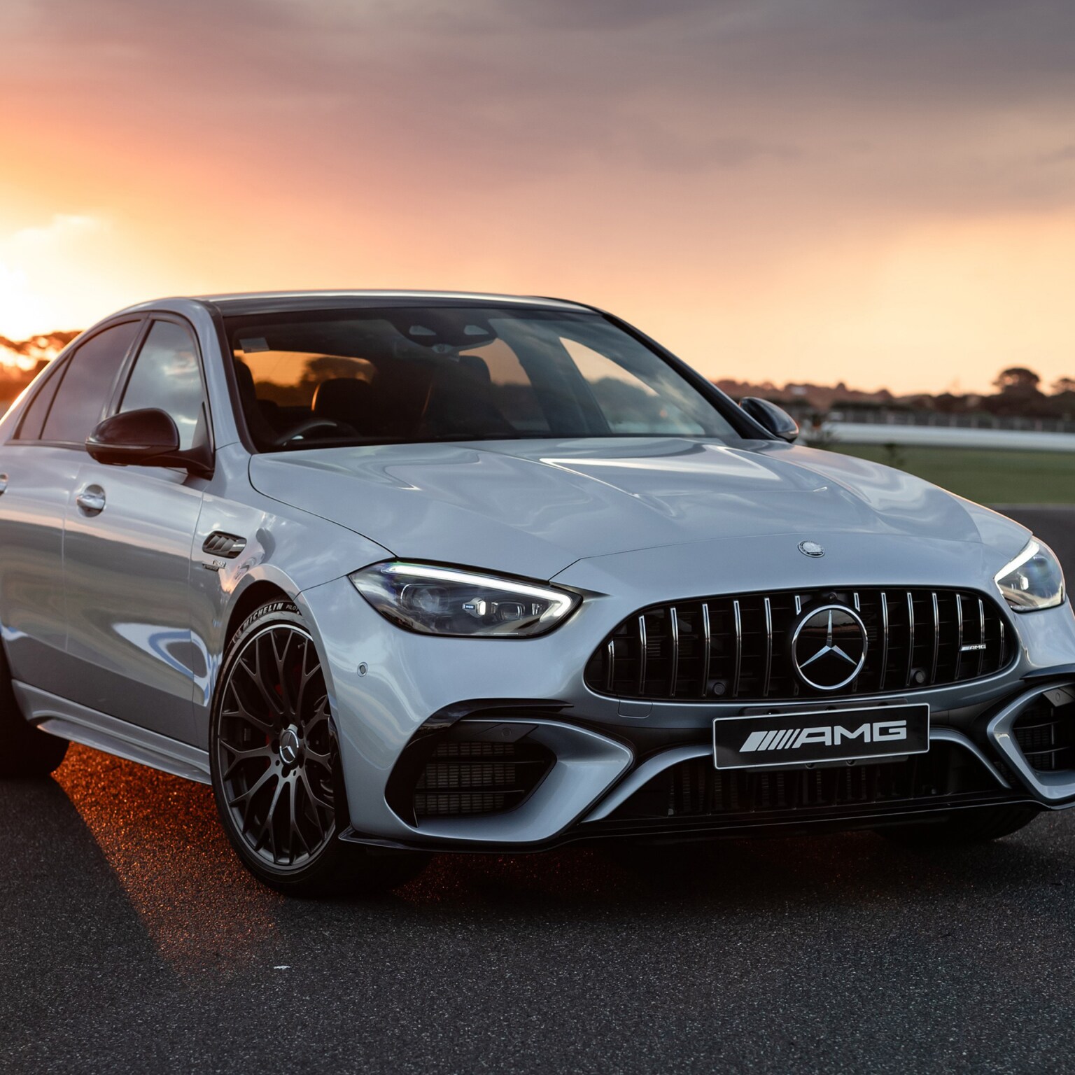 The new Mercedes-AMG C 63 S E PERFORMANCE Sedan on a racetrack.