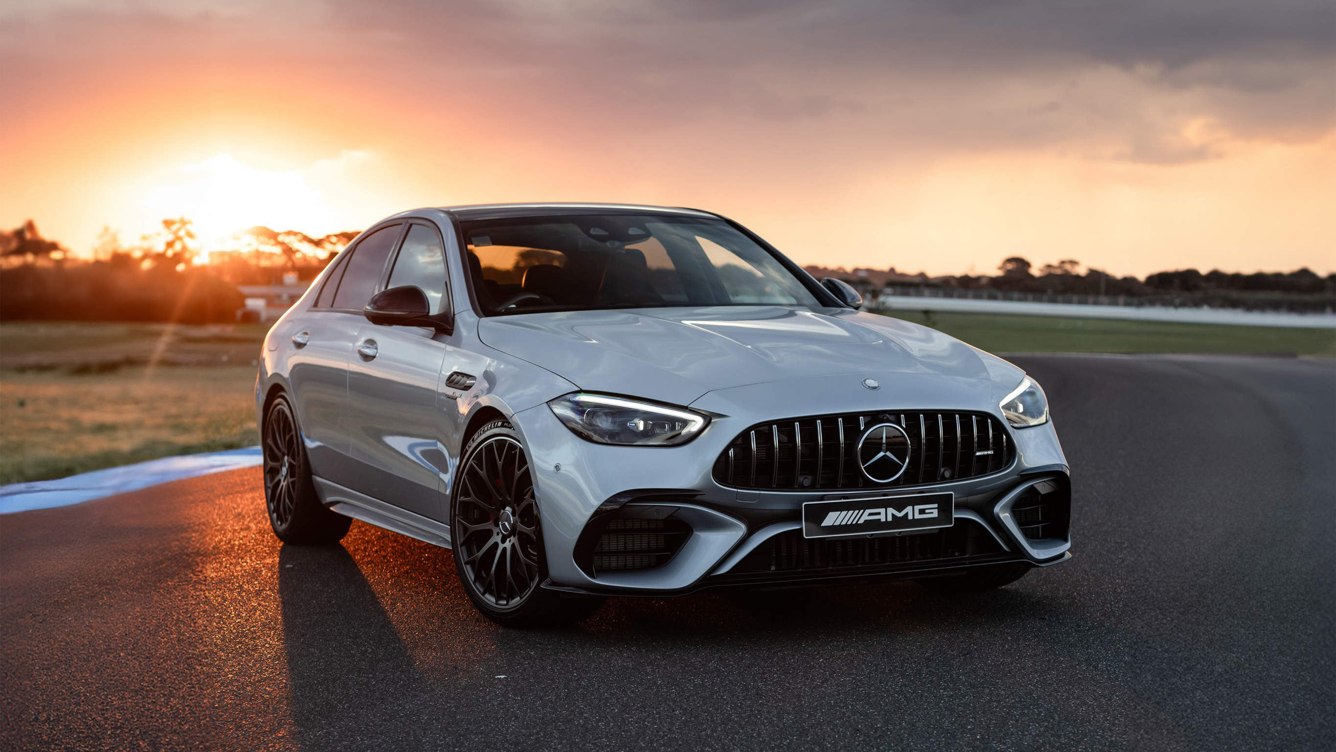 The new Mercedes-AMG C 63 S E PERFORMANCE Sedan The new Mercedes-AMG C 63 S E PERFORMANCE Sedan on a racetrack.