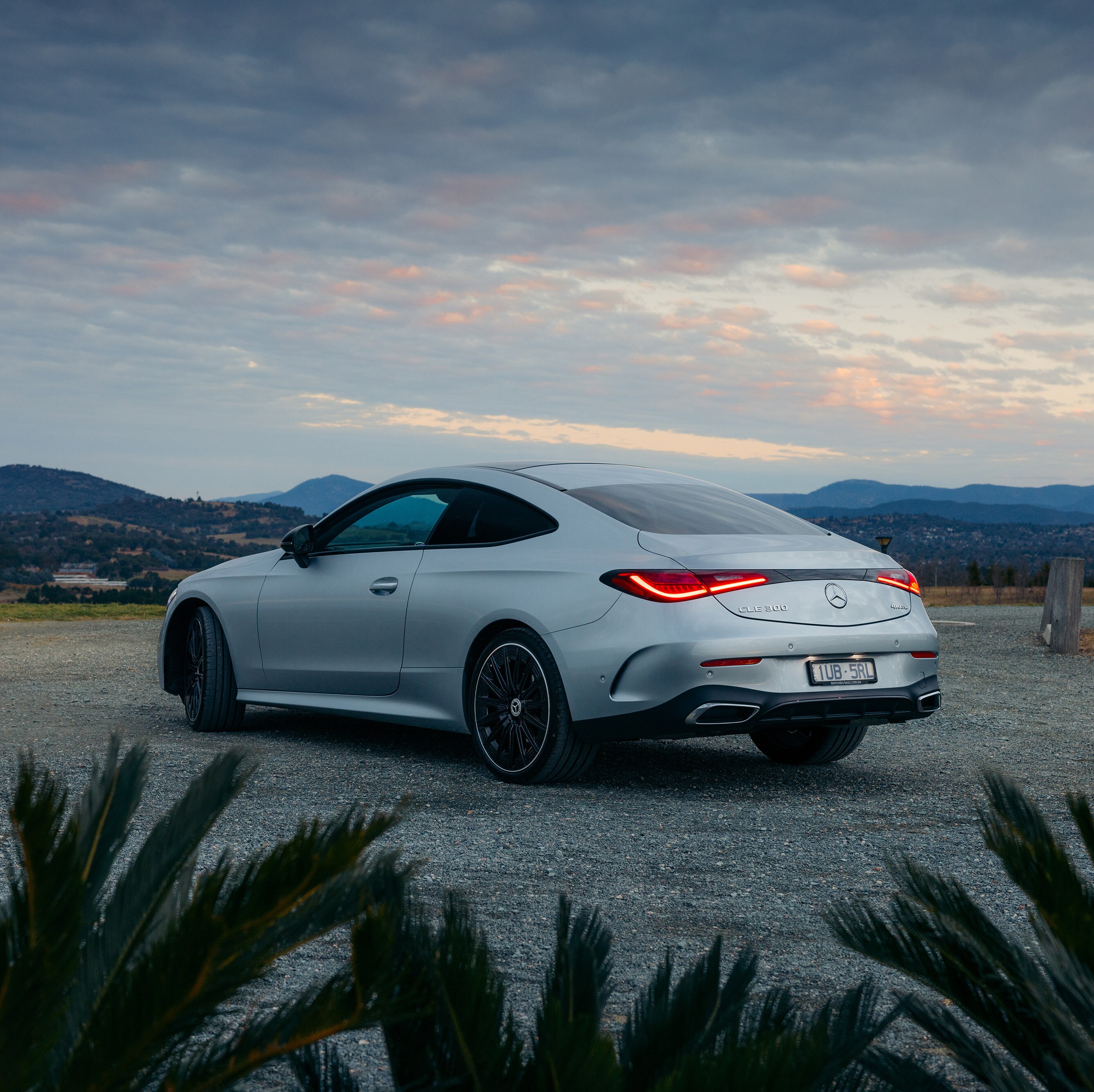A silver Mercedes-AMG CLE 300 Coupé