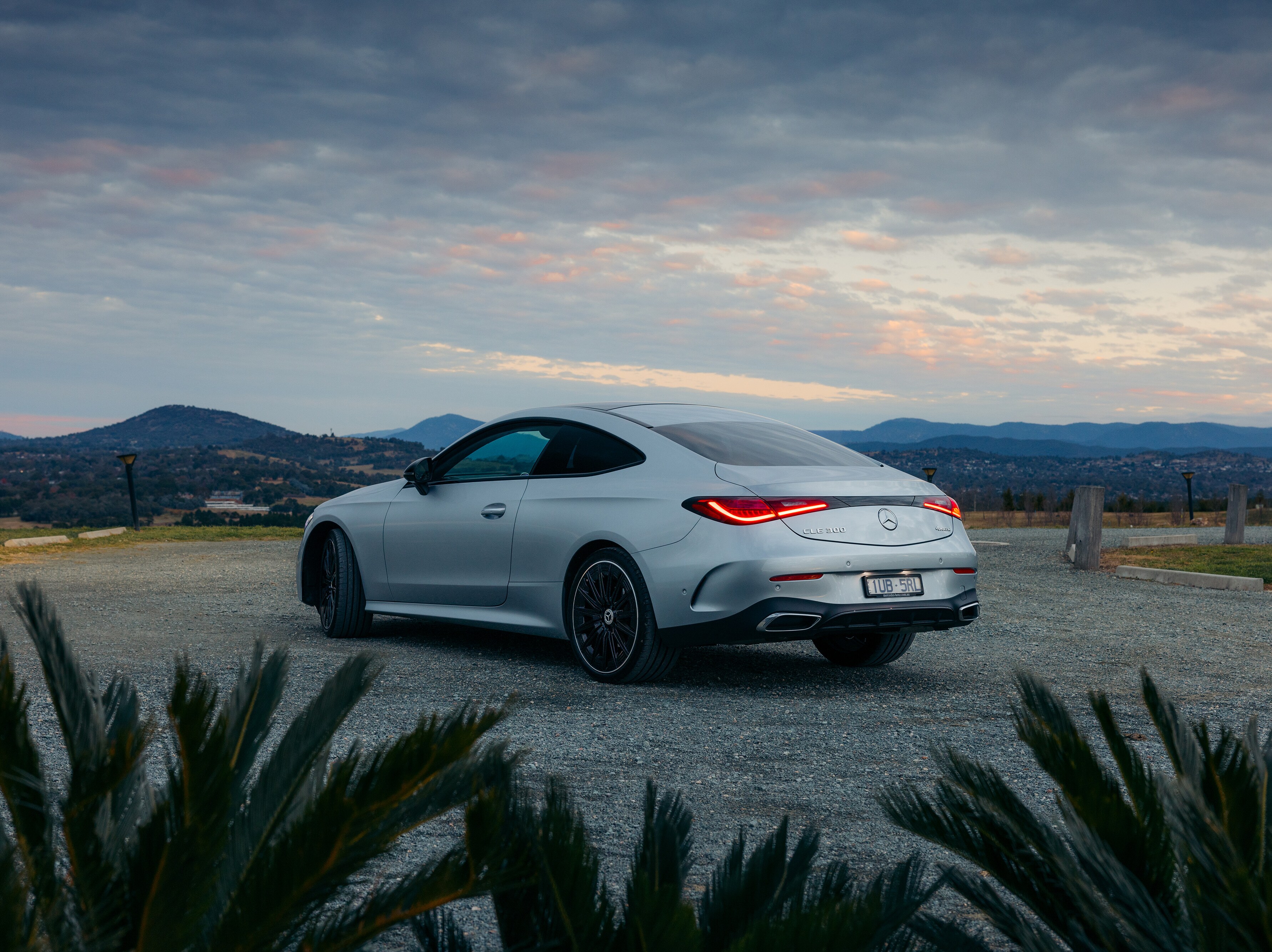 A silver Mercedes-AMG CLE 300 Coupé