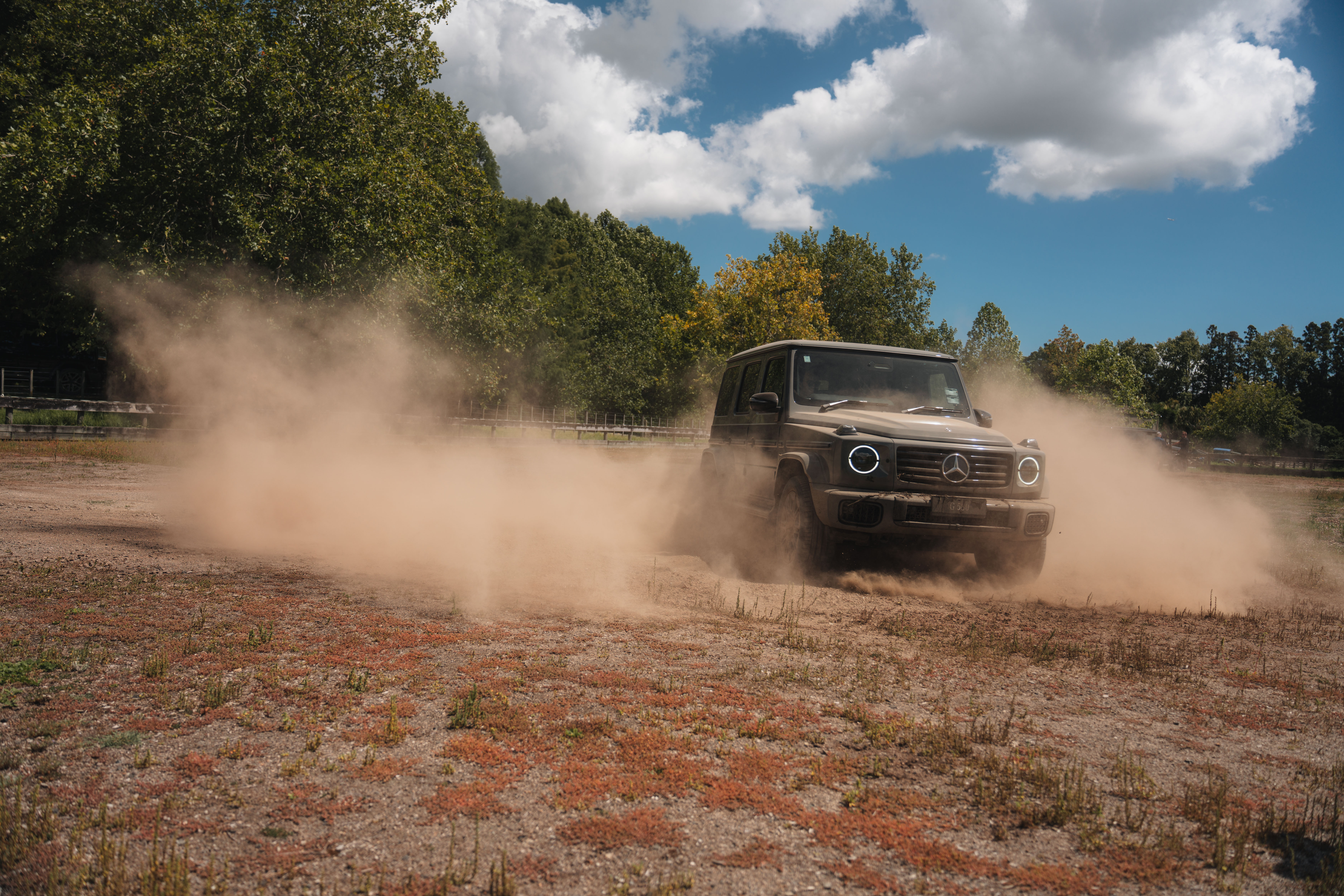 Image credit/photographer: Andrei Diomidov Mercedes-Benz G 580 driving on a dirt road