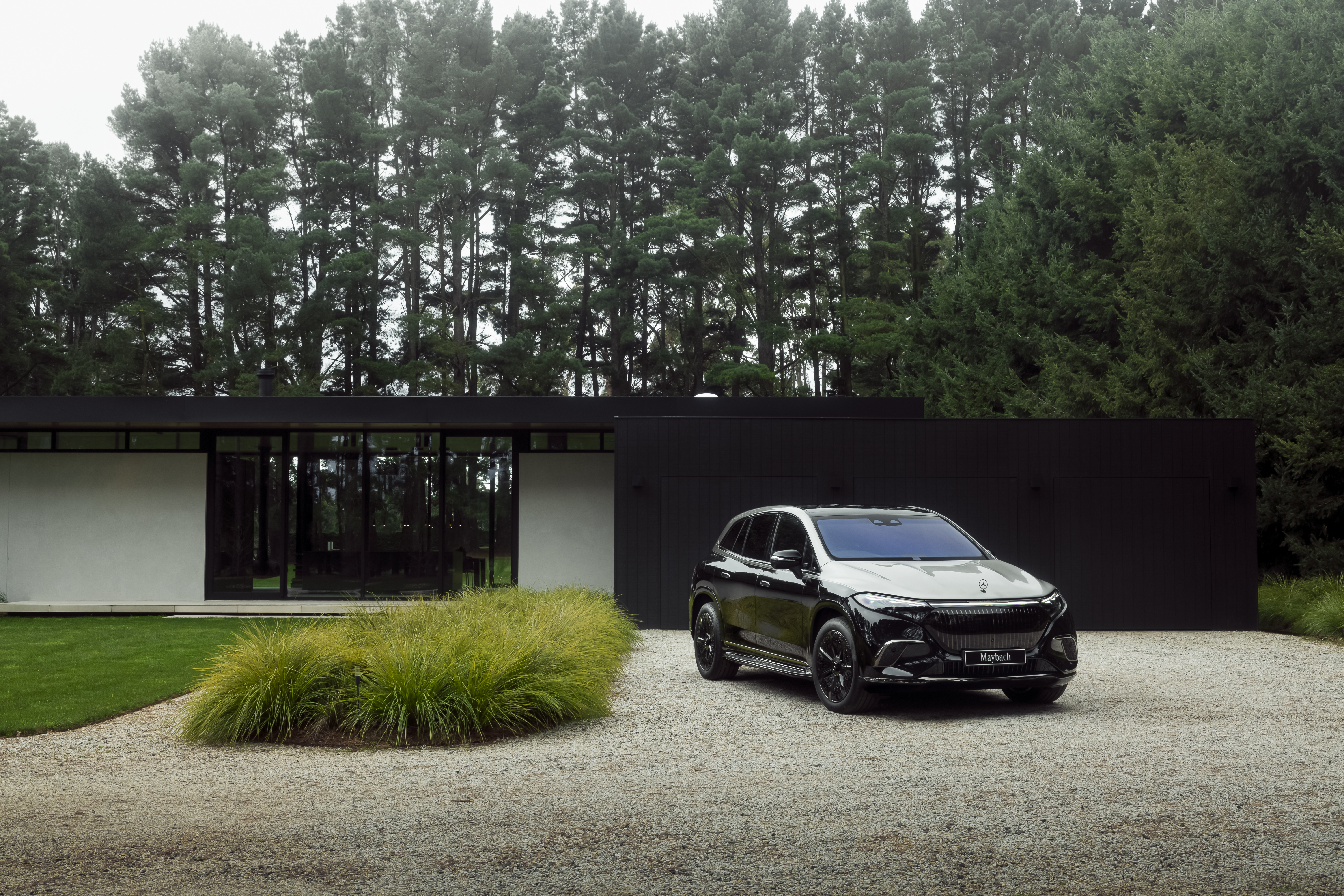 Mercedes-Maybach EQS SUV parked in a driveway. Mercedes-Maybach EQS SUV parked in a driveway.