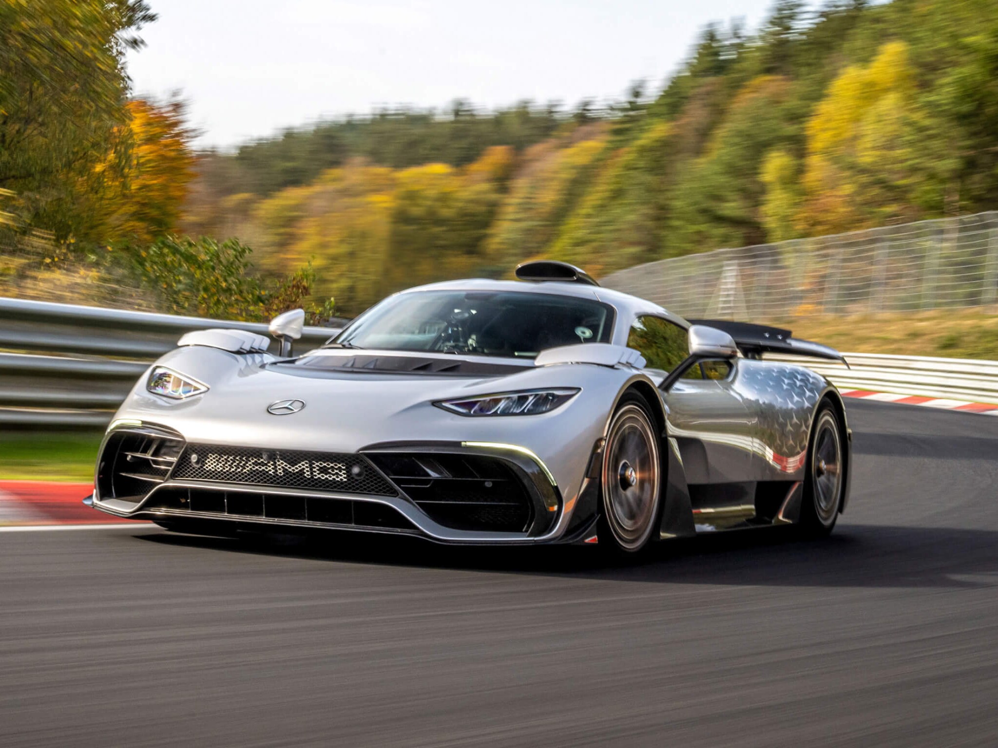 F1-inspired Mercedes-AMG ONE hypercar racing around the track. Overseas model shown. Image credit/photographer: Mercedes Benz Group AG.