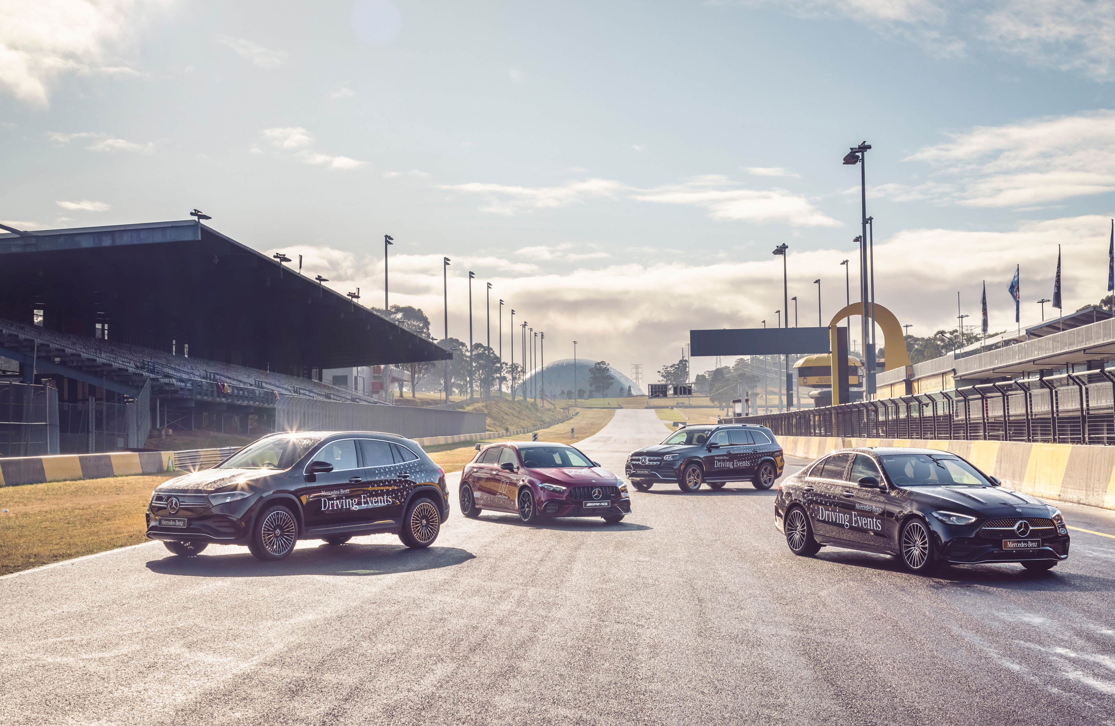 Mercedes-AMG vehicles A Mercedes-Benz and Mercedes-AMG vehicle parked on a track. Image credit/photographer: Thomas Wielecki