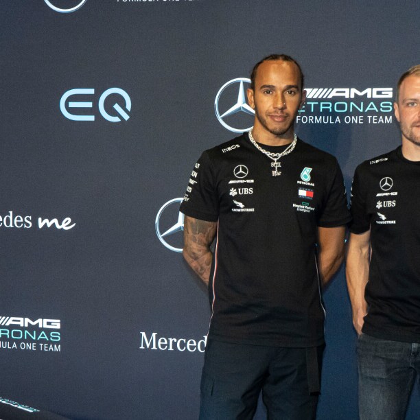 Lewis Hamilton and Valtteri Bottas pose with the VISION EQS. Image caption: Lewis Hamilton and Valtteri Bottas pose in front of the VISION EQS concept car