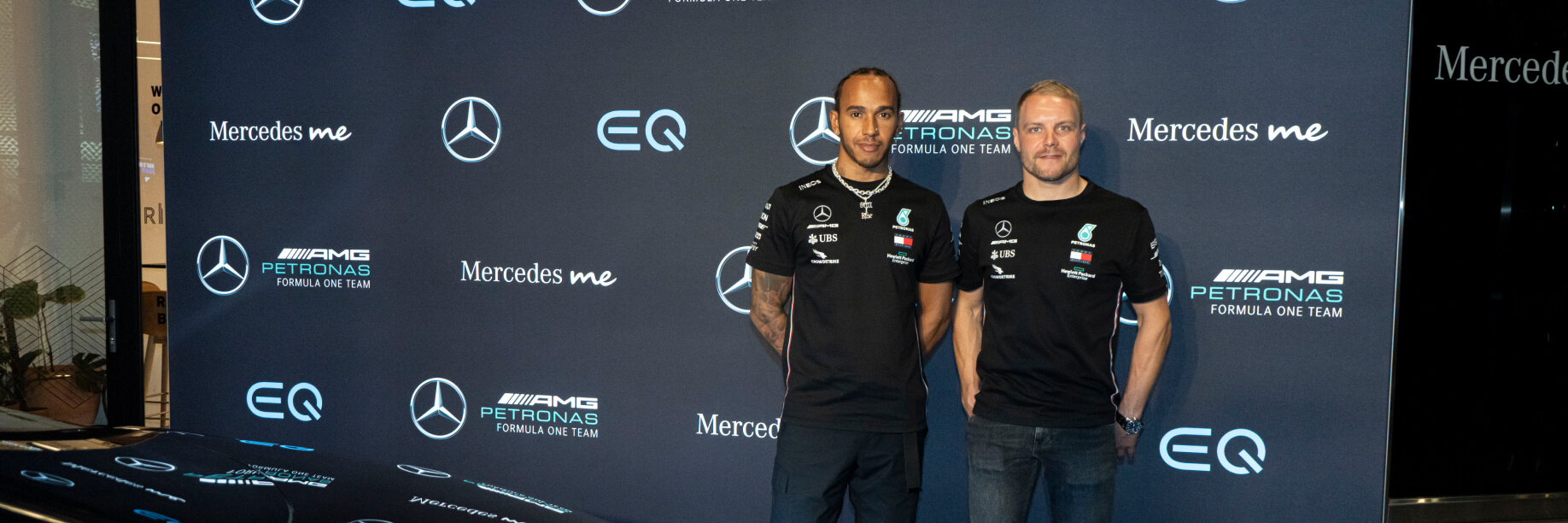 Lewis Hamilton and Valtteri Bottas_Simon Shiff Lewis Hamilton and Valtteri Bottas pose with the VISION EQS. Image caption: Lewis Hamilton and Valtteri Bottas pose in front of the VISION EQS concept car