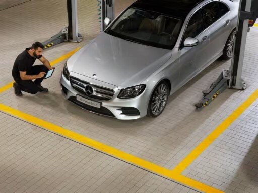 Mechanic checking a Mercedes car