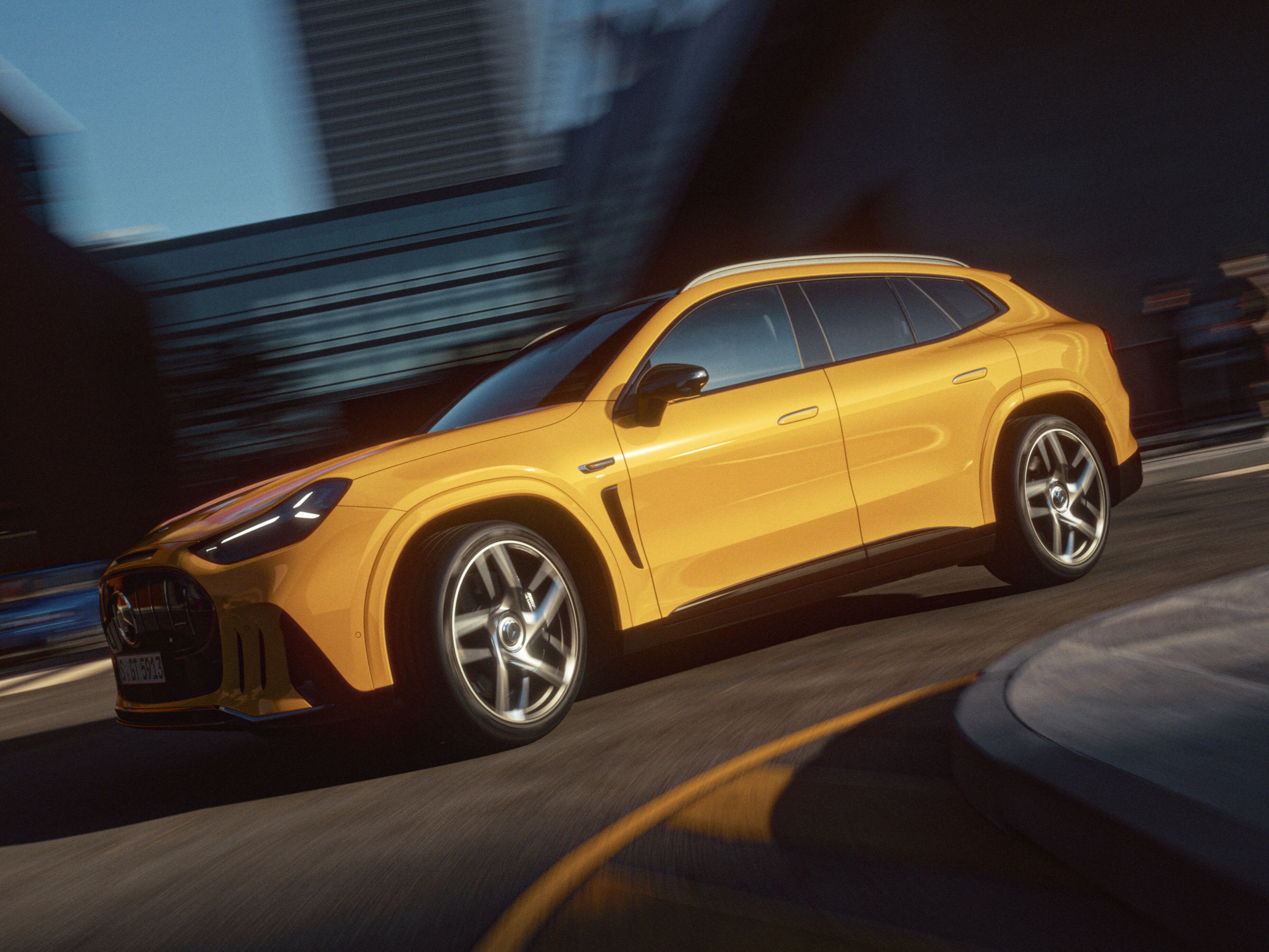 The all new Mercedes-AMG GT SUV is shown in profile on a city street, captured through a reflective window. The vehicle features large alloy wheels, sleek body lines, and tinted windows, suggesting a premium design. Urban buildings, traffic lights, and street elements in the background create a contemporary metropolitan setting. Warm sunlight enhances the metallic paint, giving the scene a polished, cinematic look.