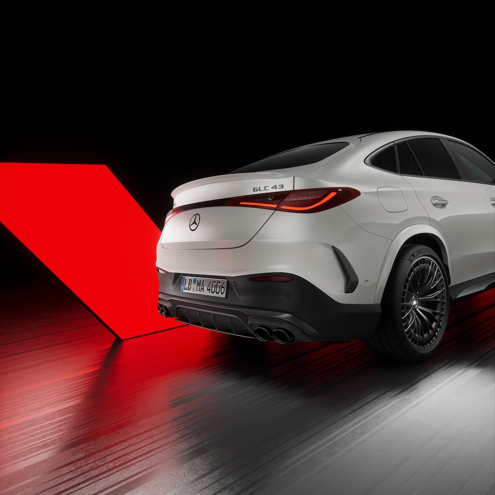 Close-up view of AMG door sills illuminated with "AMG" lettering.