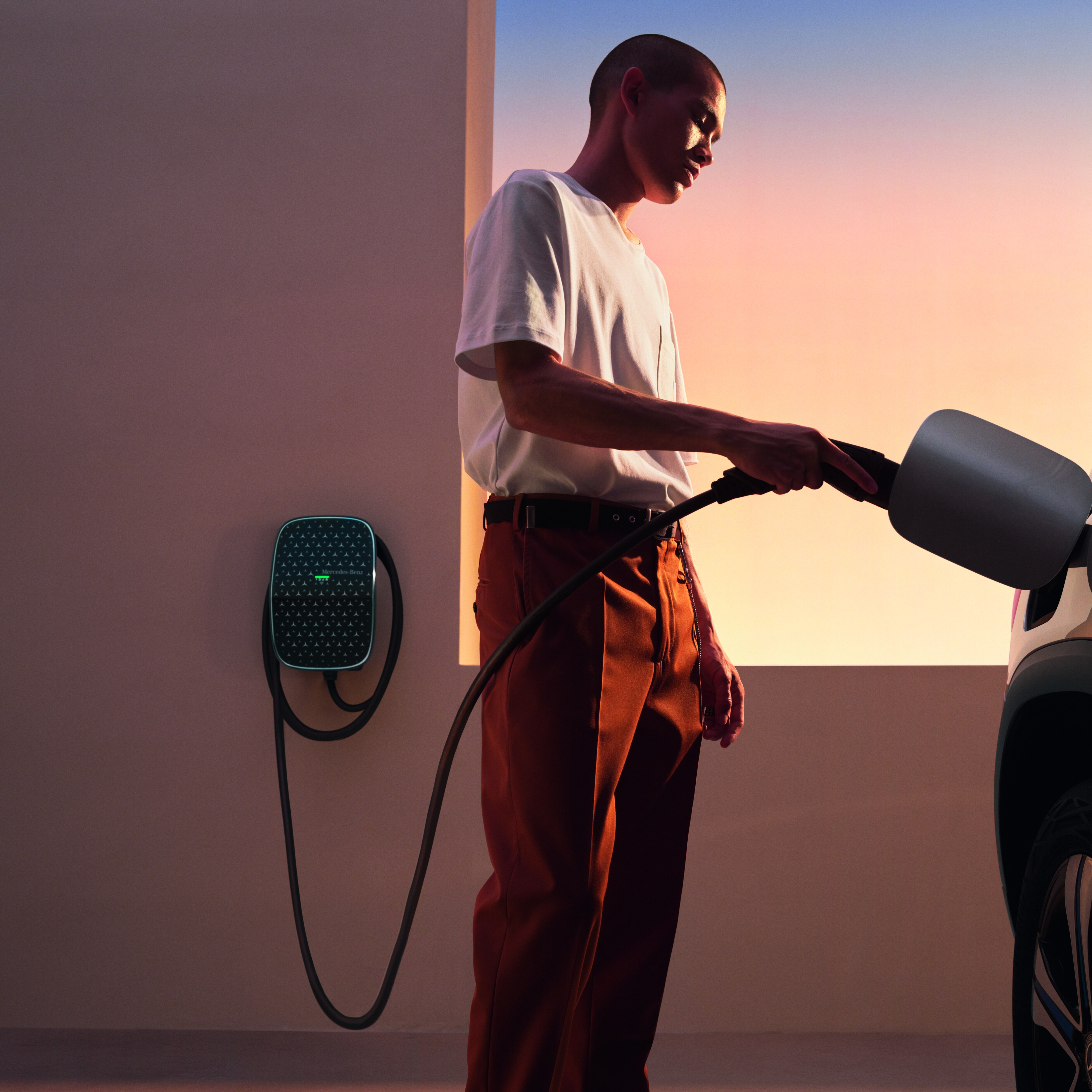 A Mercedes-Benz EQE charging at a Wallbox