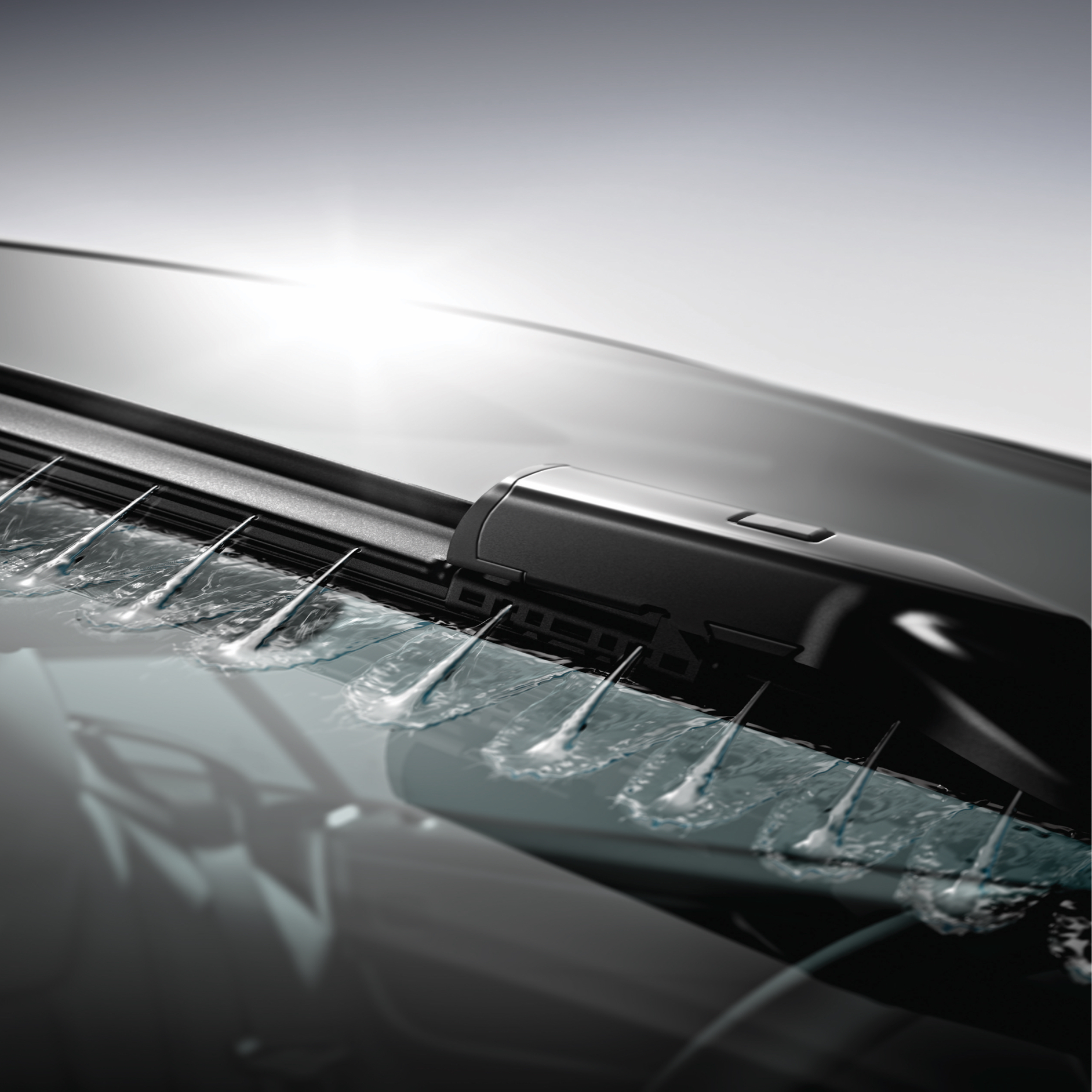 Wiper fluid is sprayed onto the windscreen Wiper fluid is sprayed onto the windscreen