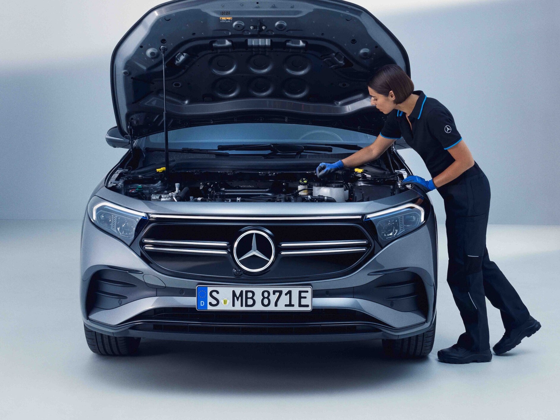 A Mercedes-Benz technician checks a Mercedes-EQ.