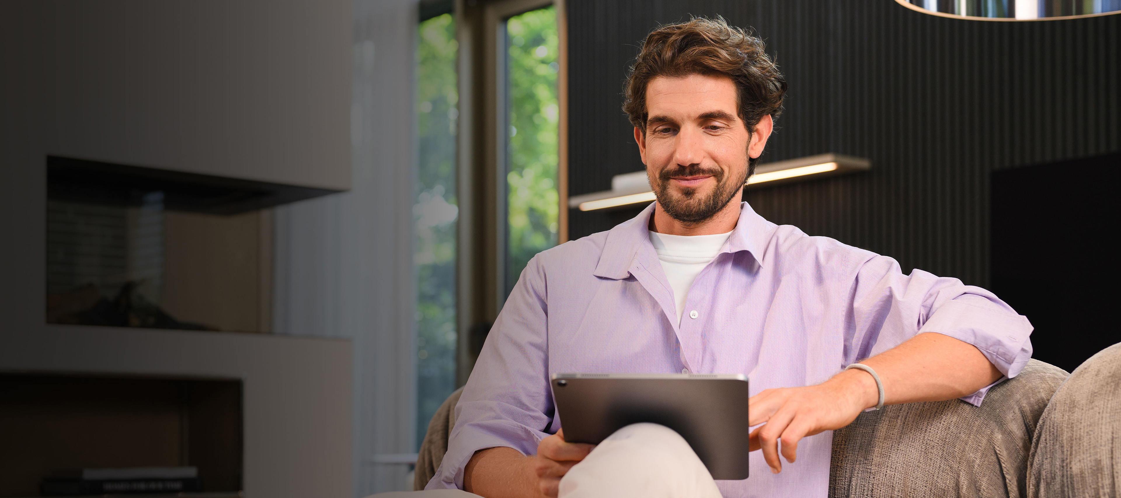 Financial Services for your Mercedes-Benz. A person on their tablet browsing Mercedes-Benz finance products.