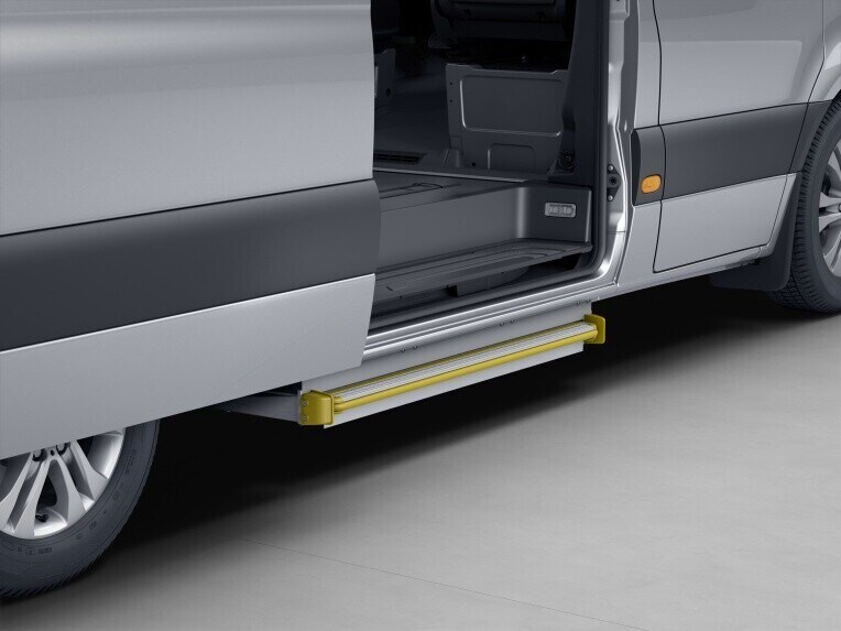 The installation of a large, electrically extendable step made of tread-resistant aluminium and sheet steel makes access or exit via the sliding load compartment doors on the sides of the vehicle easier, more comfortable and more convenient, as it provides a the step at a lower height.