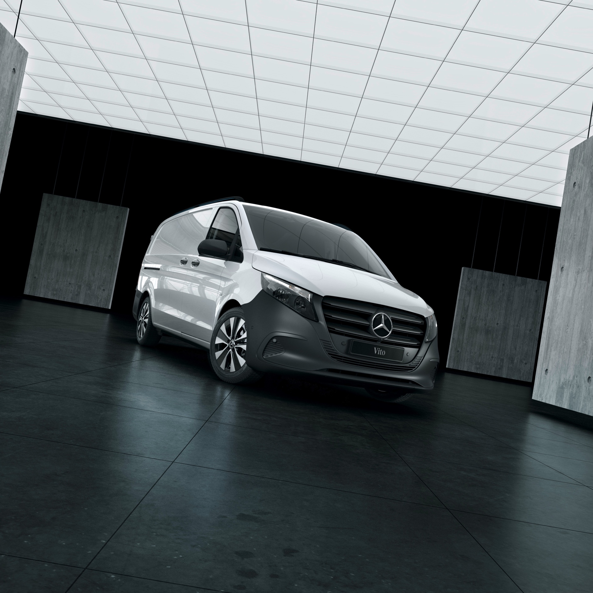 Safety and Support | Mercedes-Benz Vans The Mercedes-Benz Vito panel van stands in a warehouse surrounded by concrete walls.