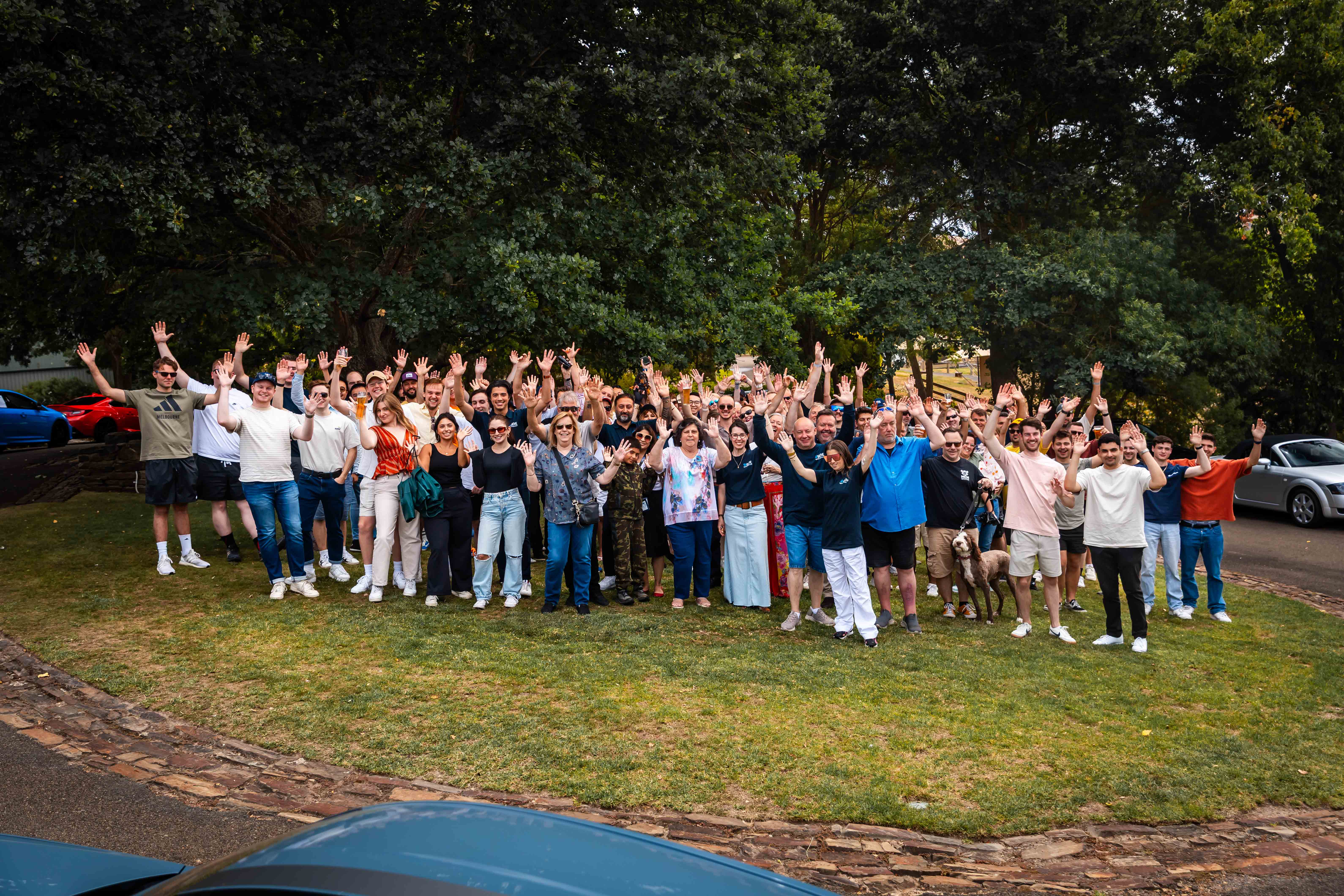 A large group of people with their hands in the air after a drive that advances mental health. A large group of people with their hands in the air after a drive that advances mental health.