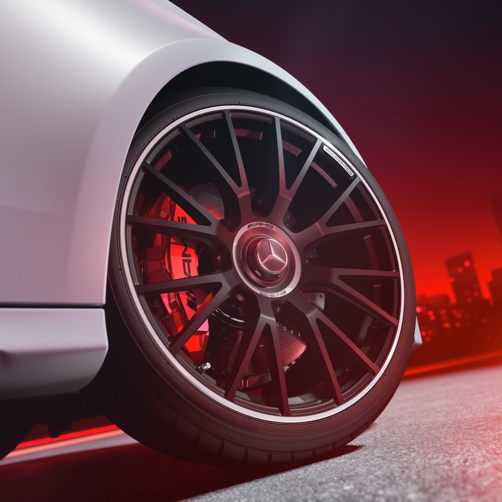 Close-up of an AMG forged wheel with AMG high-performance composite brake system with brake callipers painted in red.